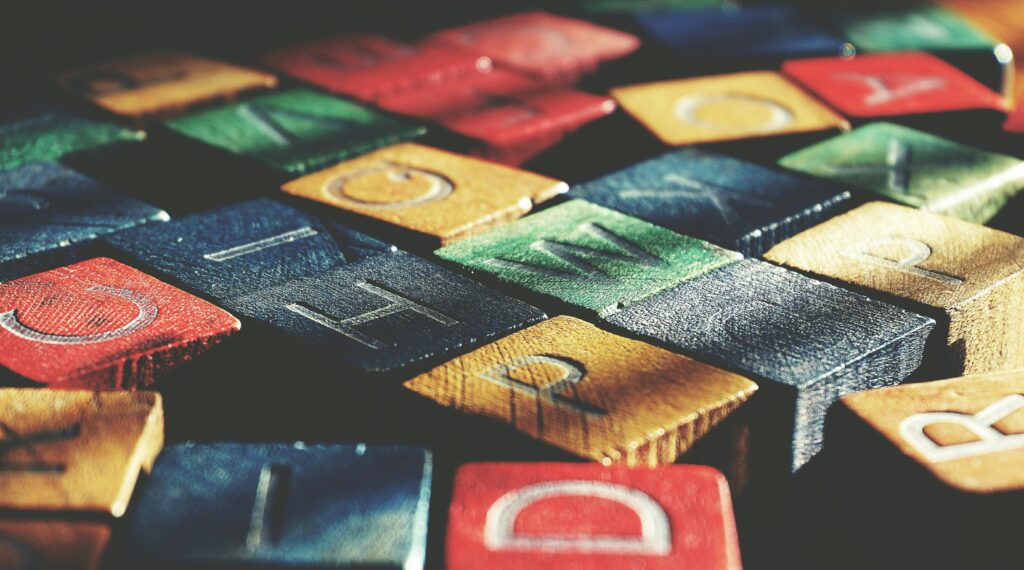 pexels photo 1822568 1822568 Vintage-style close-up of colorful wooden alphabet blocks creating an artistic pattern.